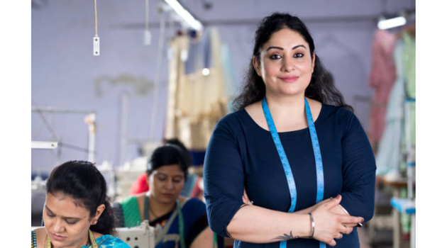 indian-women-giving-potrait-while-standing-in-a-factory-unit